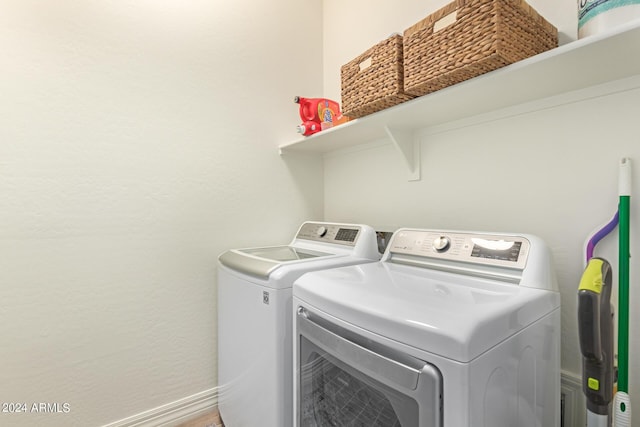 laundry area with washing machine and dryer