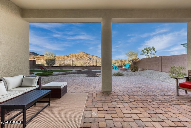 view of patio featuring outdoor lounge area and a mountain view