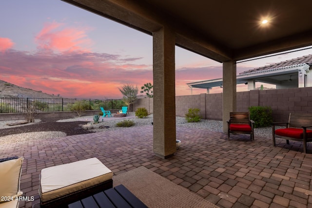 view of patio terrace at dusk