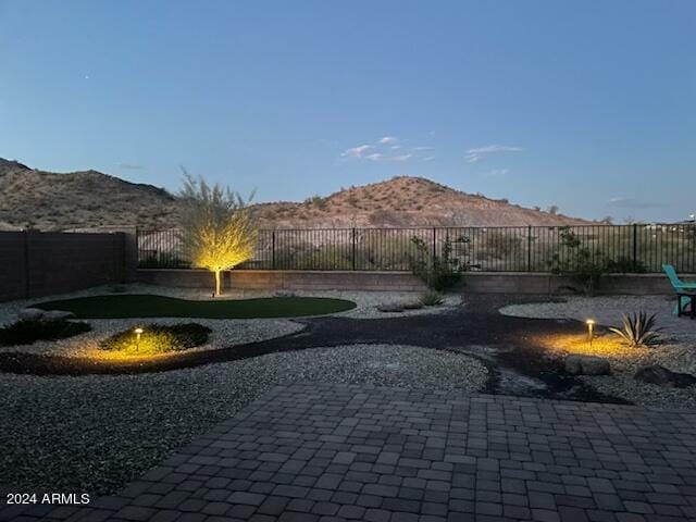 view of yard featuring a mountain view and a patio area