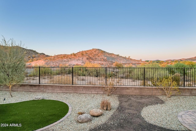 yard at dusk with a mountain view