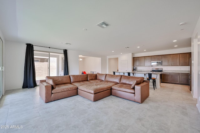 17819 W Georgia Ave, Litchfield Park, AZ 85340 - living area featuring light tile patterned floors and recessed lighting