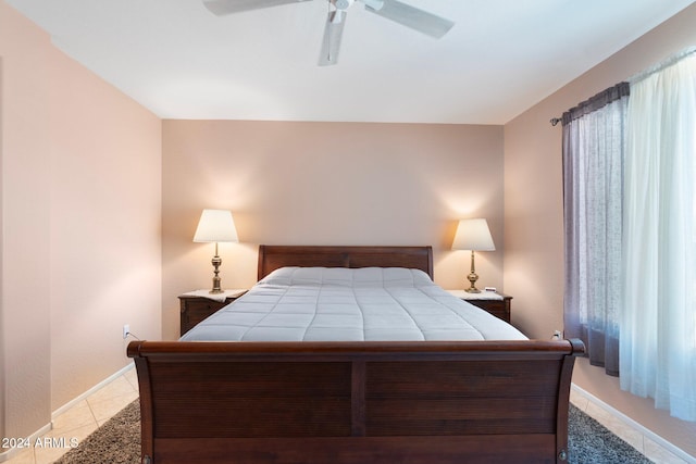 bedroom featuring ceiling fan and light tile patterned floors