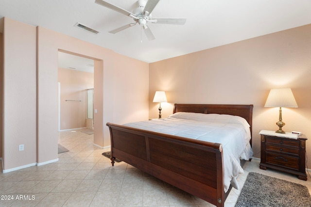 bedroom with ceiling fan and light tile patterned floors