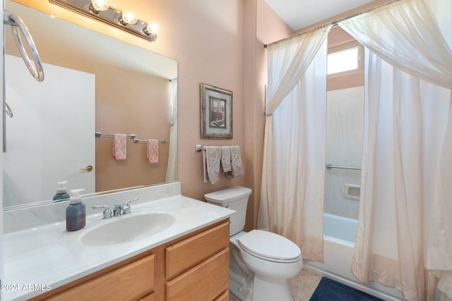 full bathroom with tile patterned floors, vanity, shower / tub combo, and toilet