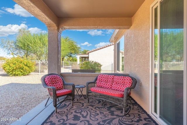 view of patio featuring a balcony