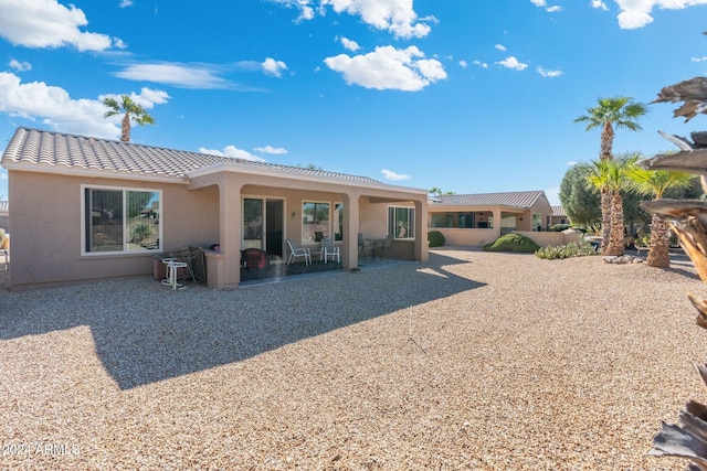 rear view of house featuring a patio