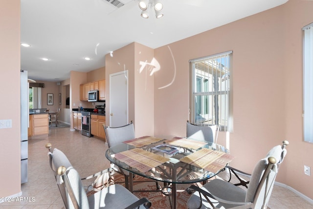 dining room featuring light tile patterned floors