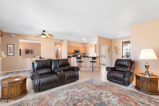 tiled living room featuring ceiling fan