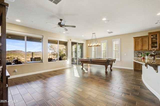 game room with a mountain view, ceiling fan, and billiards