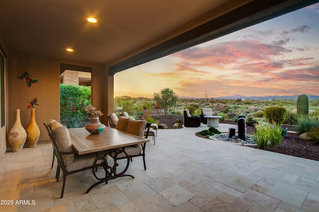 view of patio terrace at dusk