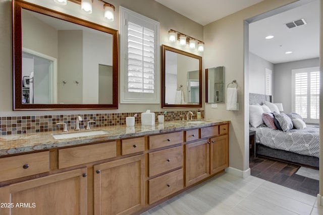 bathroom featuring backsplash and vanity