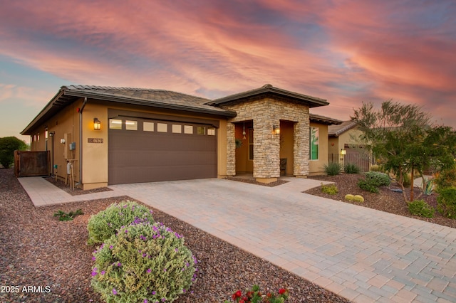 prairie-style house featuring a garage