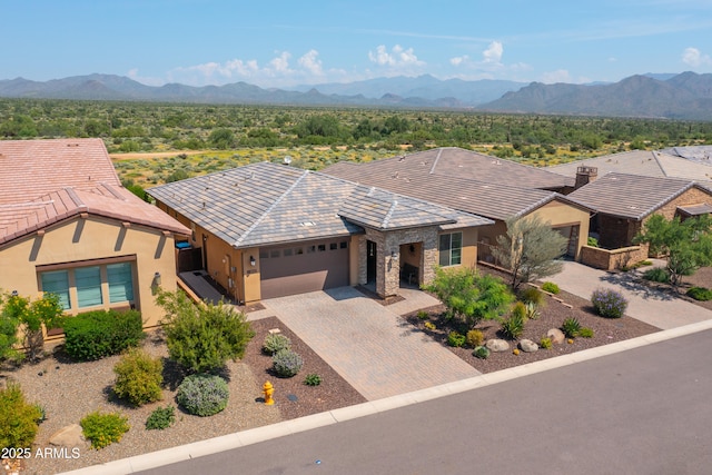 ranch-style home featuring a mountain view and a garage