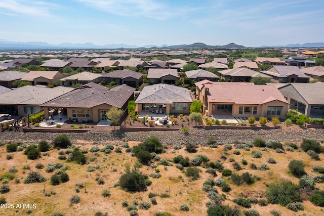 birds eye view of property with a mountain view