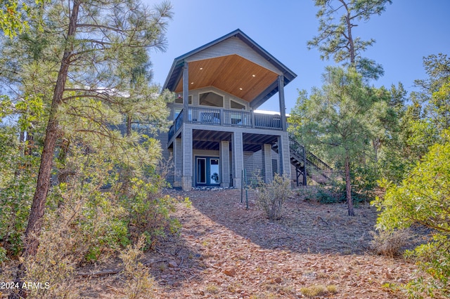 back of house featuring a wooden deck