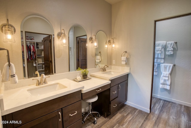 bathroom with vanity and hardwood / wood-style flooring