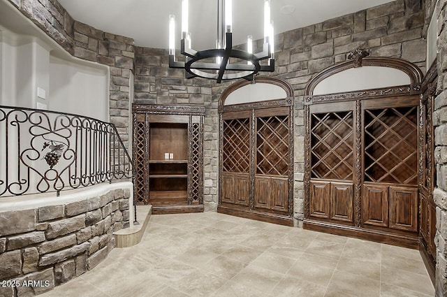 wine room featuring a notable chandelier