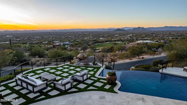 exterior space featuring a patio and a mountain view