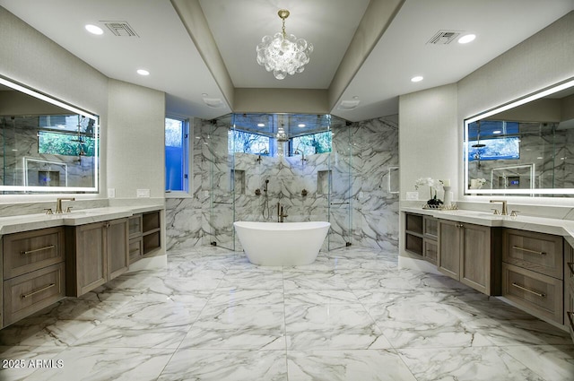 bathroom featuring tile walls, vanity, and shower with separate bathtub