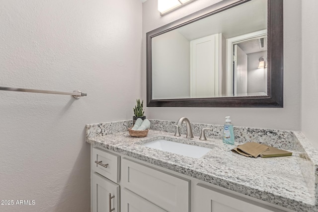 3119 W Cochise Dr Unit 111, Phoenix, AZ 85051 - bathroom with vanity and a textured wall