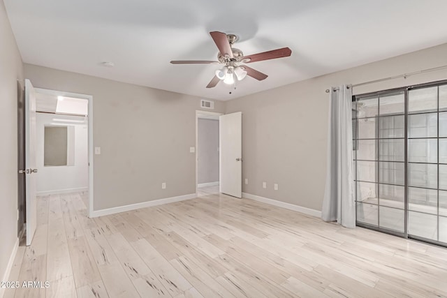 3119 W Cochise Dr Unit 111, Phoenix, AZ 85051 - unfurnished bedroom with baseboards, light wood-style flooring, and ceiling fan
