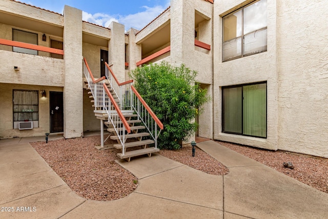 3119 W Cochise Dr Unit 111, Phoenix, AZ 85051 - view of building exterior featuring stairs and cooling unit