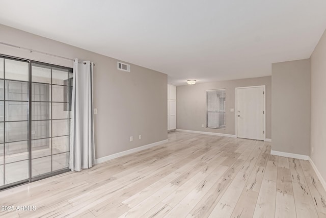 3119 W Cochise Dr Unit 111, Phoenix, AZ 85051 - empty room featuring light wood-style floors and baseboards