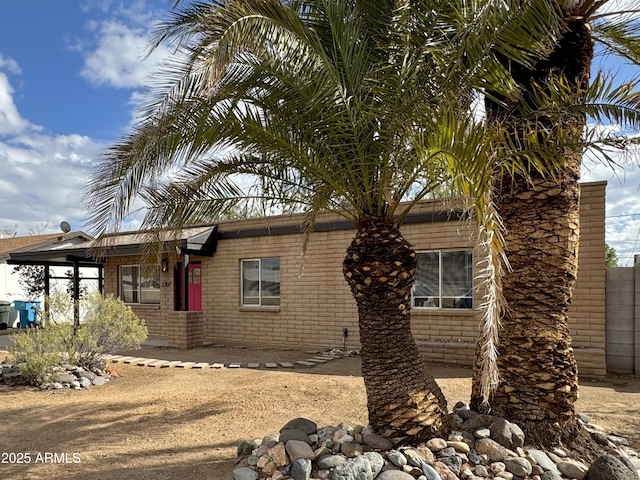 exterior space with brick siding