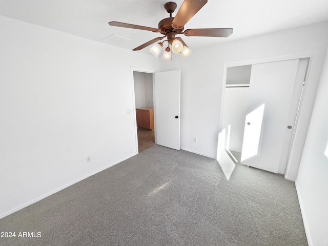 unfurnished bedroom with carpet, a closet, and ceiling fan