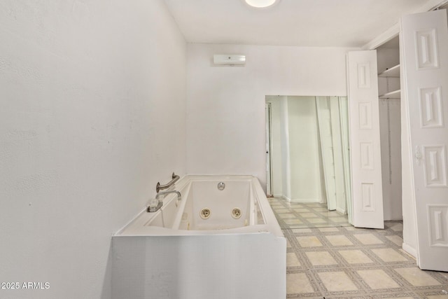 bathroom featuring a washtub