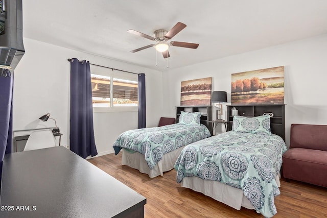 bedroom with ceiling fan and light wood-type flooring