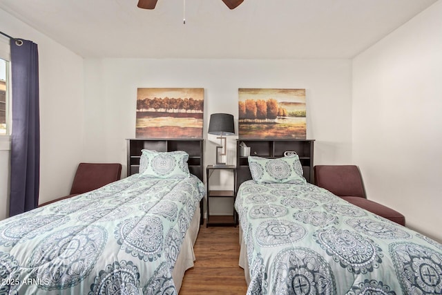 bedroom featuring wood-type flooring and ceiling fan