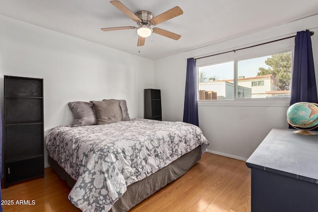 bedroom featuring hardwood / wood-style floors and ceiling fan