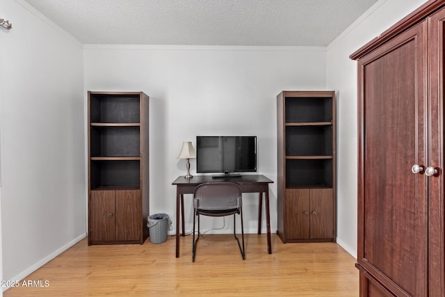 office area featuring crown molding, a textured ceiling, and light wood-type flooring