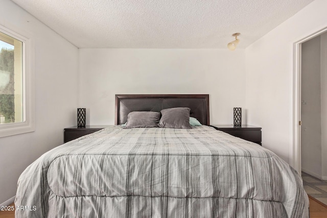 bedroom featuring a textured ceiling