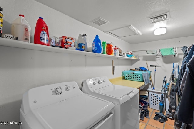 washroom featuring visible vents, laundry area, separate washer and dryer, and attic access