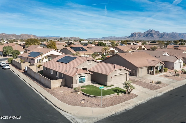 birds eye view of property featuring a mountain view