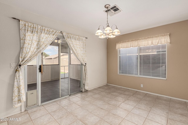 tiled empty room featuring baseboards, visible vents, and a chandelier