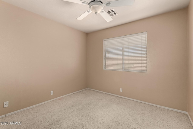 unfurnished room featuring ceiling fan, visible vents, and baseboards