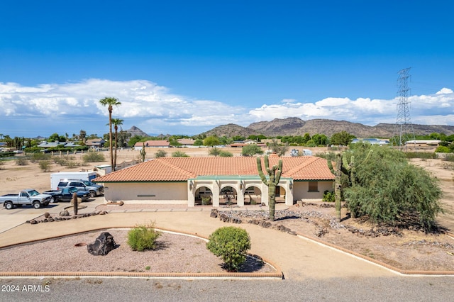 view of front of home featuring a mountain view