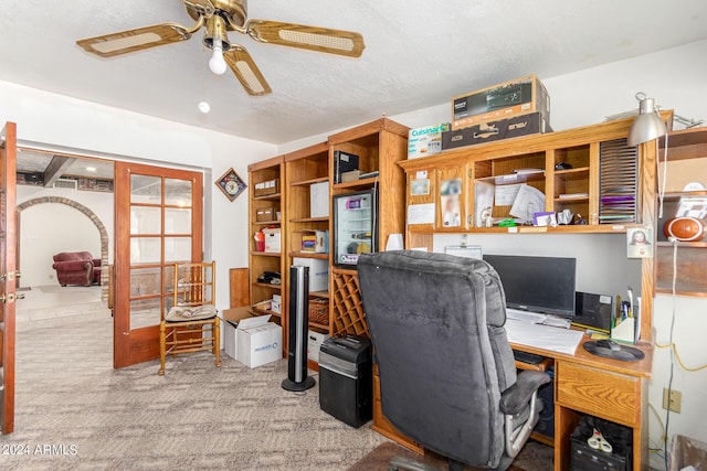 office area featuring light carpet, a textured ceiling, ceiling fan, and french doors