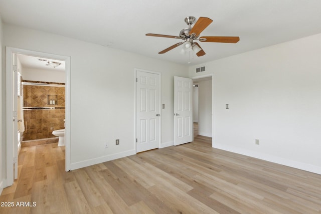 unfurnished bedroom featuring visible vents, baseboards, connected bathroom, a ceiling fan, and light wood-style flooring