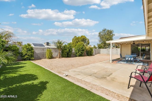 view of patio with outdoor dining area and a fenced backyard