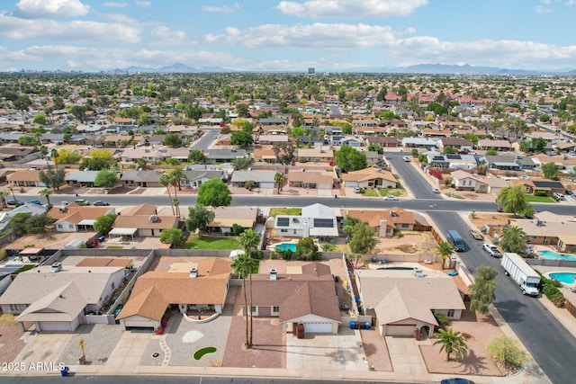 birds eye view of property featuring a mountain view and a residential view