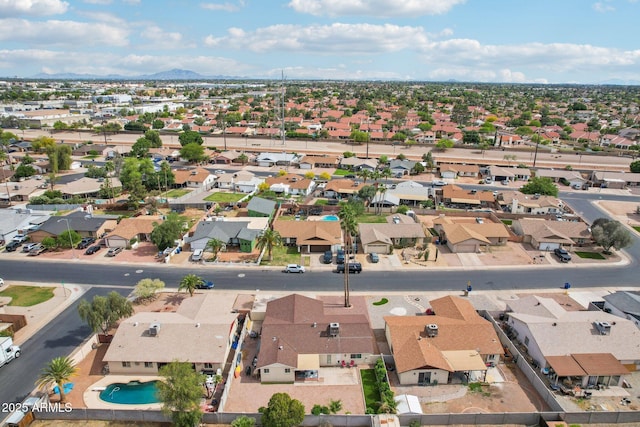 birds eye view of property with a mountain view and a residential view
