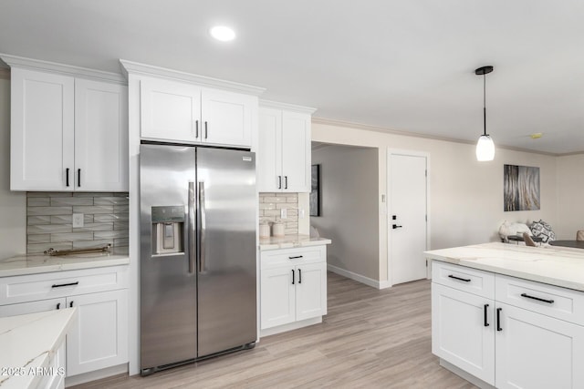 3050 E Cholla St E, Phoenix, AZ 85028 - kitchen featuring stainless steel refrigerator with ice dispenser, decorative backsplash, white cabinetry, light stone countertops, and recessed lighting