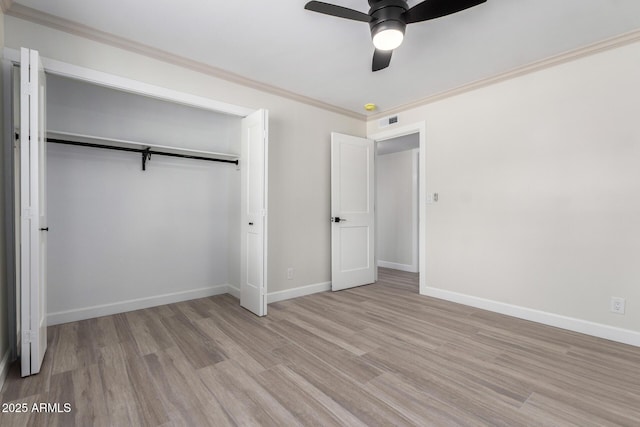 3050 E Cholla St E, Phoenix, AZ 85028 - unfurnished bedroom with light wood-type flooring, a closet, crown molding, and a ceiling fan