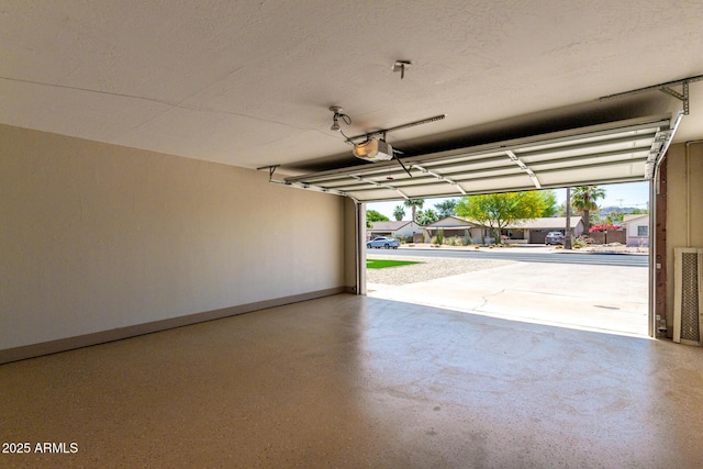 3050 E Cholla St E, Phoenix, AZ 85028 - garage with baseboards and a garage door opener