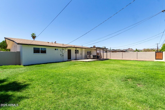 3050 E Cholla St E, Phoenix, AZ 85028 - rear view of property featuring a patio area and brick siding